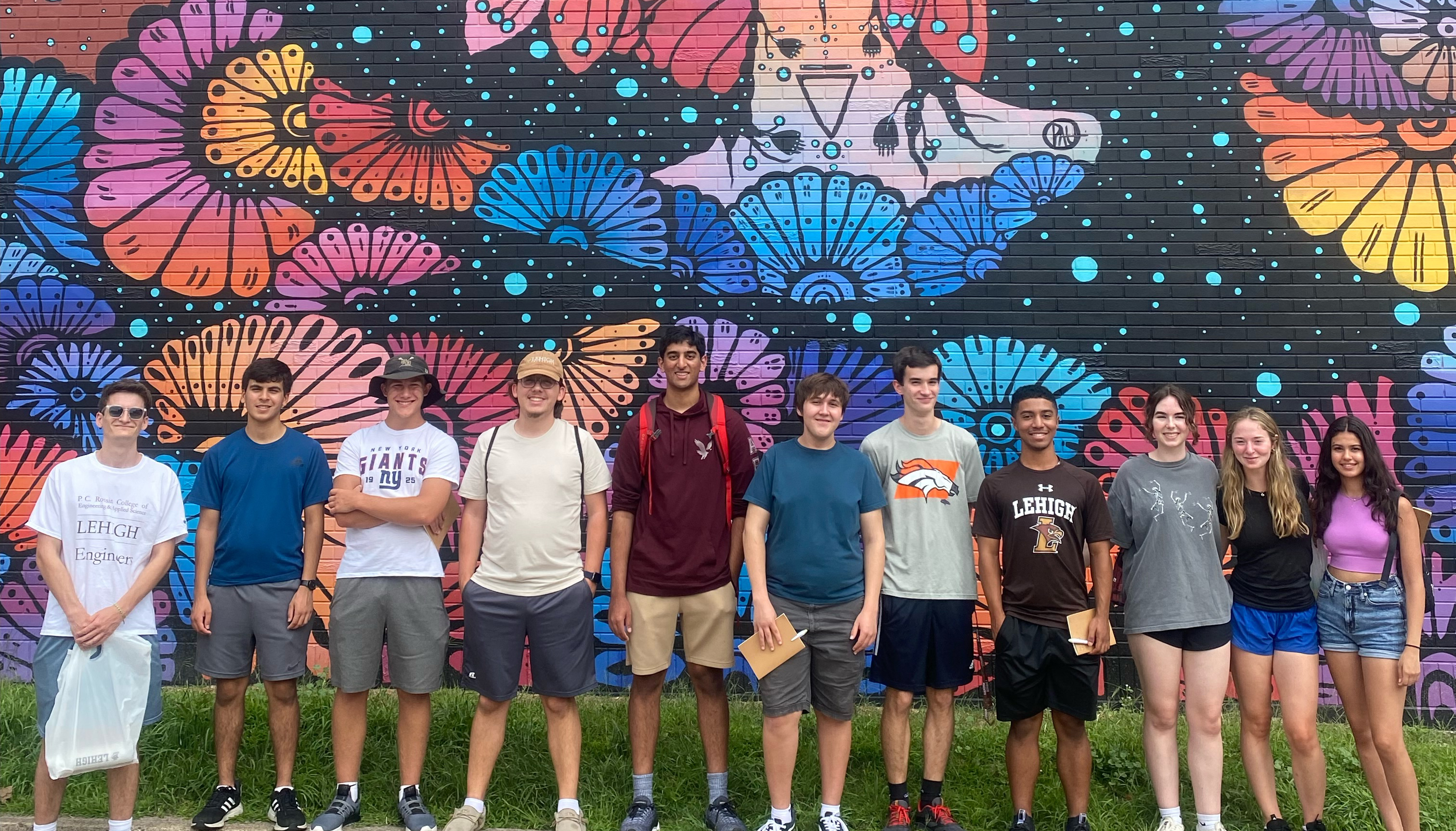 Discover Lehigh Students in front of mural in South Bethlehem