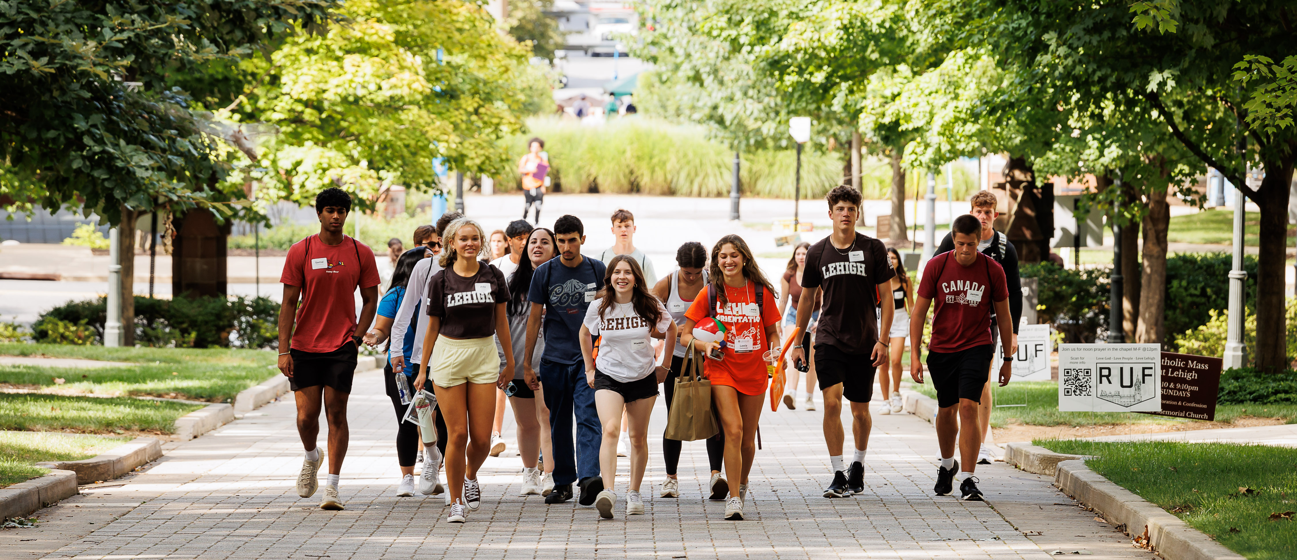 Orientation Leader walking with their group on campus