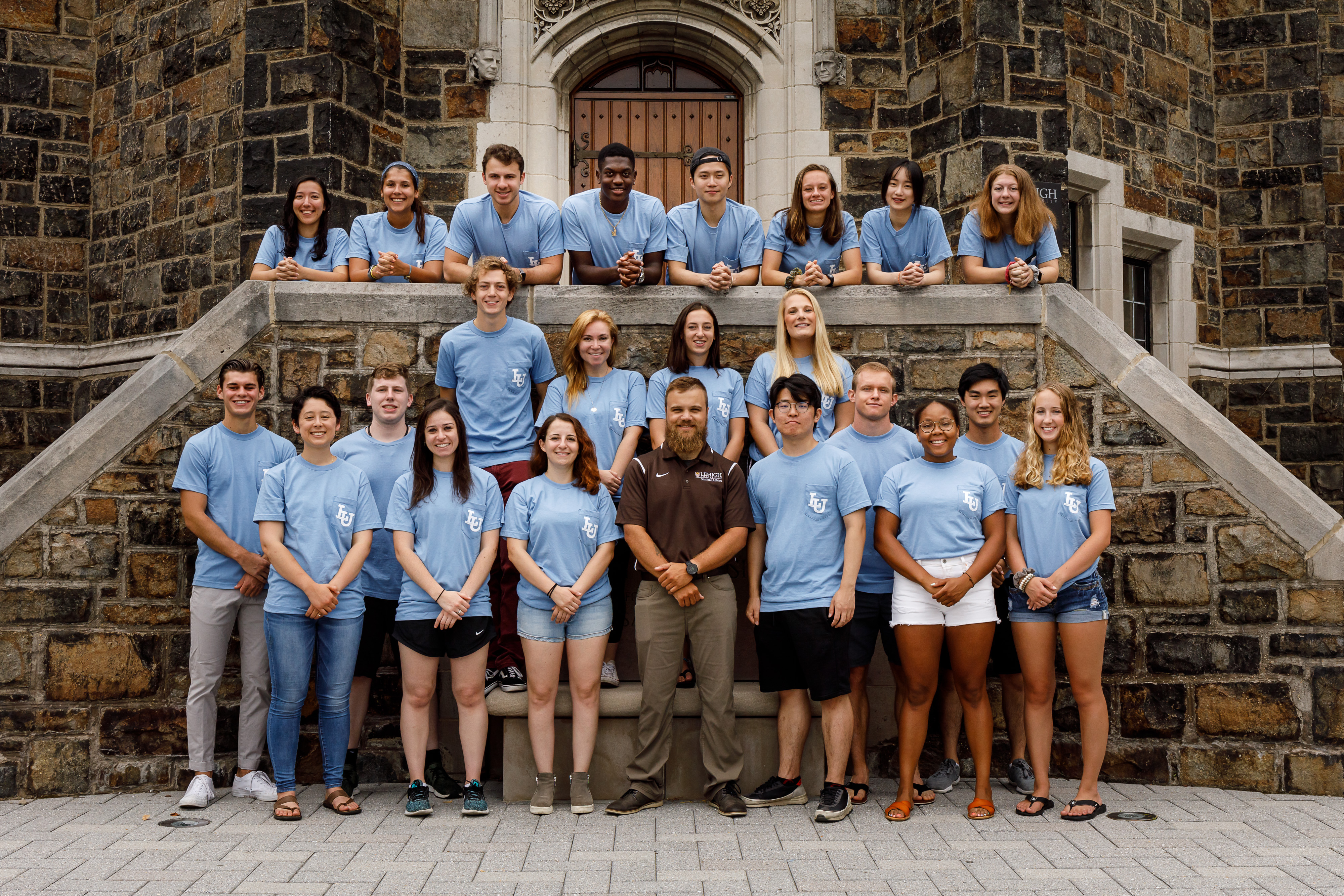 Brodley Warfare gryphons in front of the Alumni Memorial Building