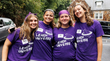 Orientation Leaders outside of Residence Hall at Move In