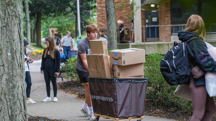 students moving in to residence hall