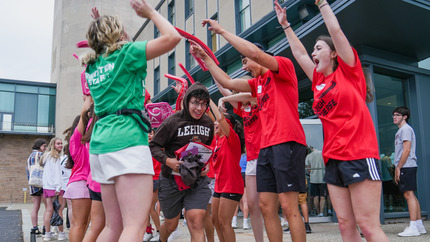 Orientation Leaders welcoming students at Orientation check-in