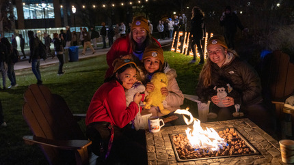 LAD participants by a fire pit