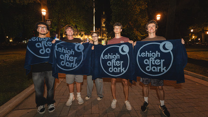 students with their LAD giveaways at an event