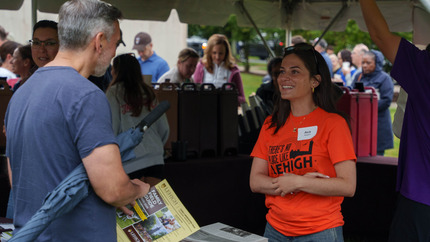 Orientation Leaders talking with families at check-in