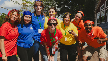 Camp Hawk Counselors posing in their color Camp Hawk t-shirts