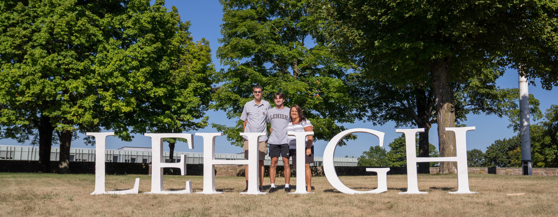 family with Lehigh letters at check-in